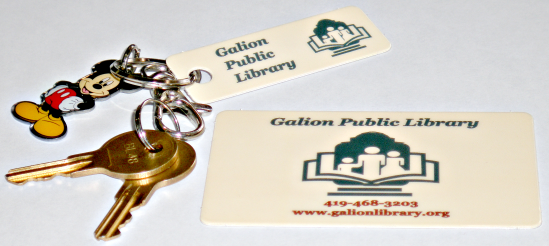 [Photo of library card and keychain]