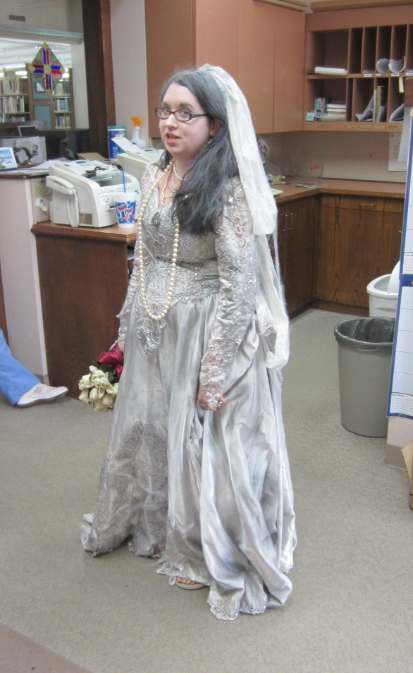 [photo of library staff member in formal costume gown]