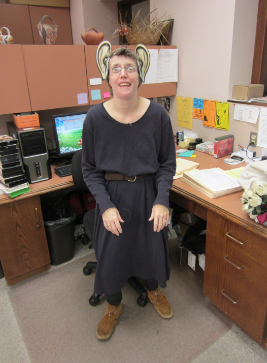 [photo of library staff member in costume with big ears]