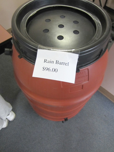 [photo - rain barrel on display, sign reads Rain Barrel $96.00]