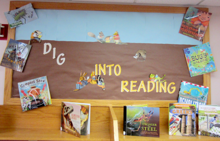 [photo of the Dig Into Reading bulletin board]
